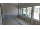 Renovation in progress, showing new flooring and windows at 110 S Oxford Dr, Englewood, FL 34223