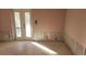 Room under construction with exposed walls and flooring at 110 S Oxford Dr, Englewood, FL 34223