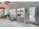 Sunroom with ample natural light and access to the backyard at 110 S Oxford Dr, Englewood, FL 34223