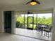 Bright screened porch with tiled floors, sliding doors and backyard access at 4691 Club Dr # 102, Port Charlotte, FL 33953