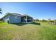 Large backyard with a view of the canal at 9194 Impala Cir, Port Charlotte, FL 33981