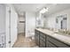 Double vanity bathroom with granite countertops and modern fixtures at 9194 Impala Cir, Port Charlotte, FL 33981
