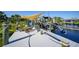 Relaxing dockside seating area with shade sail and boat access at 9194 Impala Cir, Port Charlotte, FL 33981