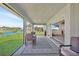 Screened porch with water views and comfortable seating area at 9194 Impala Cir, Port Charlotte, FL 33981