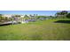Spacious backyard with canal views and lush lawn at 9194 Impala Cir, Port Charlotte, FL 33981