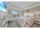 Spacious bedroom with king-size bed and view of backyard at 9194 Impala Cir, Port Charlotte, FL 33981