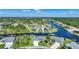 Aerial view of waterfront community with houses and canals at 9194 Impala Cir, Port Charlotte, FL 33981