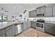 Modern kitchen with stainless steel appliances and granite counters at 9194 Impala Cir, Port Charlotte, FL 33981