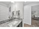 Simple bathroom with granite countertop and a view into the living room at 9194 Impala Cir, Port Charlotte, FL 33981