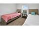 Bright bedroom with two twin beds and ample natural light at 9194 Impala Cir, Port Charlotte, FL 33981