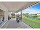 Spacious screened porch with outdoor furniture and water views at 9194 Impala Cir, Port Charlotte, FL 33981