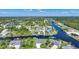 Aerial view of waterfront community with houses and canals at 9194 Impala Cir, Port Charlotte, FL 33981