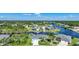 Aerial view of waterfront community with houses and canals at 9194 Impala Cir, Port Charlotte, FL 33981