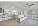 Open concept kitchen with island and breakfast bar, flows into living area at 9194 Impala Cir, Port Charlotte, FL 33981