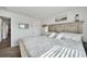Spacious primary bedroom with large bed and en-suite bathroom access at 9194 Impala Cir, Port Charlotte, FL 33981