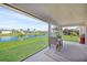 Enjoy the water views from this screened porch with seating area at 9194 Impala Cir, Port Charlotte, FL 33981