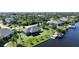 Aerial view of waterfront home with private dock and canal access at 9194 Impala Cir, Port Charlotte, FL 33981