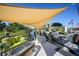 Relaxing dockside patio area, complete with seating and shade structure at 9194 Impala Cir, Port Charlotte, FL 33981