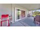 Covered patio with comfortable seating and access to the interior at 9194 Impala Cir, Port Charlotte, FL 33981