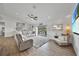 Bright living room with large sectional sofa,water view, and sliding glass doors at 9194 Impala Cir, Port Charlotte, FL 33981