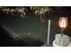 Close-up of a waterfront dock at night with a solar torch light at 9194 Impala Cir, Port Charlotte, FL 33981