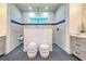 Modern bathroom with a large walk-in shower and double vanity at 8250 Arlewood Cir, Port Charlotte, FL 33981