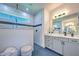 Spa-like bathroom with walk-in shower and double vanity at 8250 Arlewood Cir, Port Charlotte, FL 33981