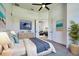 Bright bedroom with coastal decor, hardwood floors, and access to the living room at 8250 Arlewood Cir, Port Charlotte, FL 33981