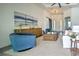 Bright and airy living room with comfortable seating and large artwork at 8250 Arlewood Cir, Port Charlotte, FL 33981