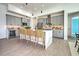 Modern kitchen with gray cabinets, quartz countertops, and stainless steel appliances at 8250 Arlewood Cir, Port Charlotte, FL 33981