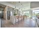 Modern kitchen with island, stainless steel appliances, and breakfast bar at 8250 Arlewood Cir, Port Charlotte, FL 33981