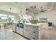 Modern kitchen with island, sink, and water views at 8250 Arlewood Cir, Port Charlotte, FL 33981