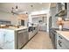 Modern kitchen with large island, stainless steel appliances, and farm sink at 8250 Arlewood Cir, Port Charlotte, FL 33981