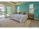 Spacious main bedroom with water view and sliding glass doors at 8250 Arlewood Cir, Port Charlotte, FL 33981