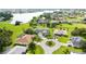 Aerial view showcasing a desirable community with homes surrounding a lake at 26021 Templar Ln, Punta Gorda, FL 33983