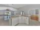 Kitchen with island, views of the pool, and hardwood floors at 26021 Templar Ln, Punta Gorda, FL 33983