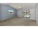 Primary bedroom with sliding doors leading to the pool area at 26021 Templar Ln, Punta Gorda, FL 33983