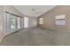 Spacious main bedroom with sliding glass doors leading to the pool area at 26021 Templar Ln, Punta Gorda, FL 33983