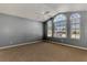 Spacious bedroom with arched windows and neutral decor at 26021 Templar Ln, Punta Gorda, FL 33983