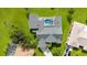 Aerial view of a house with pool, large backyard, and surrounding neighborhood at 26021 Templar Ln, Punta Gorda, FL 33983