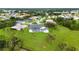 Aerial view of home with pool, large backyard and a view of neighborhood at 26021 Templar Ln, Punta Gorda, FL 33983