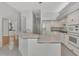 Kitchen with white cabinets and breakfast bar at 26021 Templar Ln, Punta Gorda, FL 33983