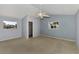 Primary bedroom with light blue walls and carpet at 26021 Templar Ln, Punta Gorda, FL 33983