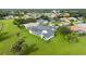 Aerial view of property showing house with pool and large green space at 26021 Templar Ln, Punta Gorda, FL 33983