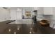 Modern kitchen with white cabinets, dark countertops, and stainless steel appliances at 5850 Gasparilla Rd # M1&3, Boca Grande, FL 33921