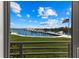 Scenic waterfront view with marina and flag at 5850 Gasparilla Rd # M1&3, Boca Grande, FL 33921