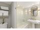 Clean bathroom with a bathtub and pedestal sink at 5850 Gasparilla Rd # M1&3, Boca Grande, FL 33921
