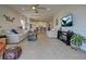 Spacious living room offering an open floor plan and large TV at 26724 Weiskopf Dr, Englewood, FL 34223