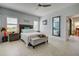 Spacious bedroom with tiled floors, a full bed, and plenty of natural light at 26724 Weiskopf Dr, Englewood, FL 34223