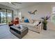 Comfortable living room with beige sofa and wood coffee table at 26724 Weiskopf Dr, Englewood, FL 34223